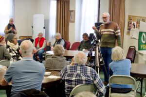 People listen to candidate Tom O'Donnell in the community room at St. Michael's Episcopal Church.