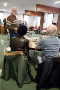 People listen to candidate Tom O'Donnell in the community room at St. Michael's Episcopal Church.