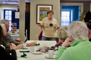 Linda Whitten speaks to the audience at the Bentonsport Stone House.
