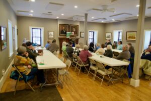 Supporters listen to candidate Tom O'Donnell at the Bentonsport Stone House.