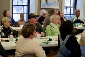 People listen to candidate Tom O'Donnell at the Bentonsport Stone House.