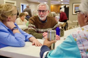 Tom O'Donnell chats with supporters at the Bentonsport Stone House.