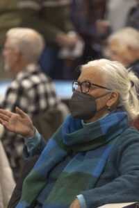 Holly Moore listens to Tom O'Donnell at the Fairfield Public Library.
