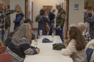 People chat at the Fairfield Public Library after Tom O'Donnell's remarks.