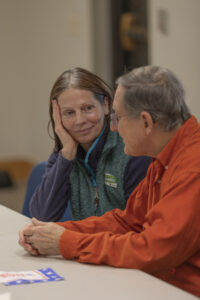 Two supporters talk as they await Tom O'Donnell at the Fairfield Public Library.