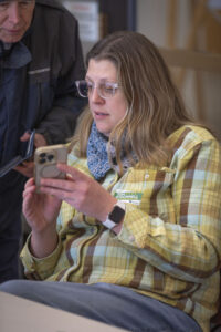 Jefferson County Democratic Party Chair Hattie Peck looks at her cellphone at the Fairfield Public Library.